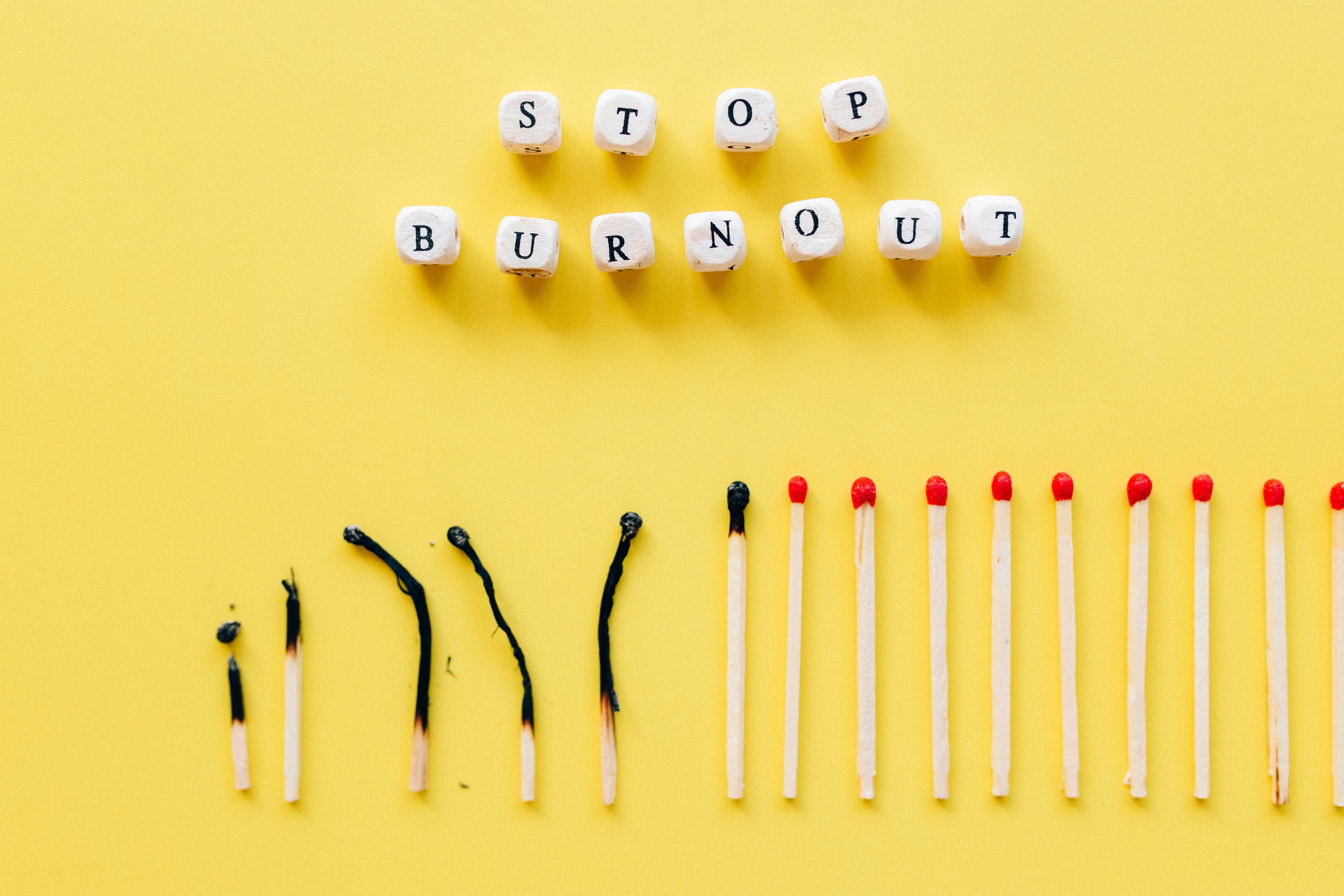 Stop autistic burnout and shutdown; image shows a line of matches, with some burnt and some not burnt.