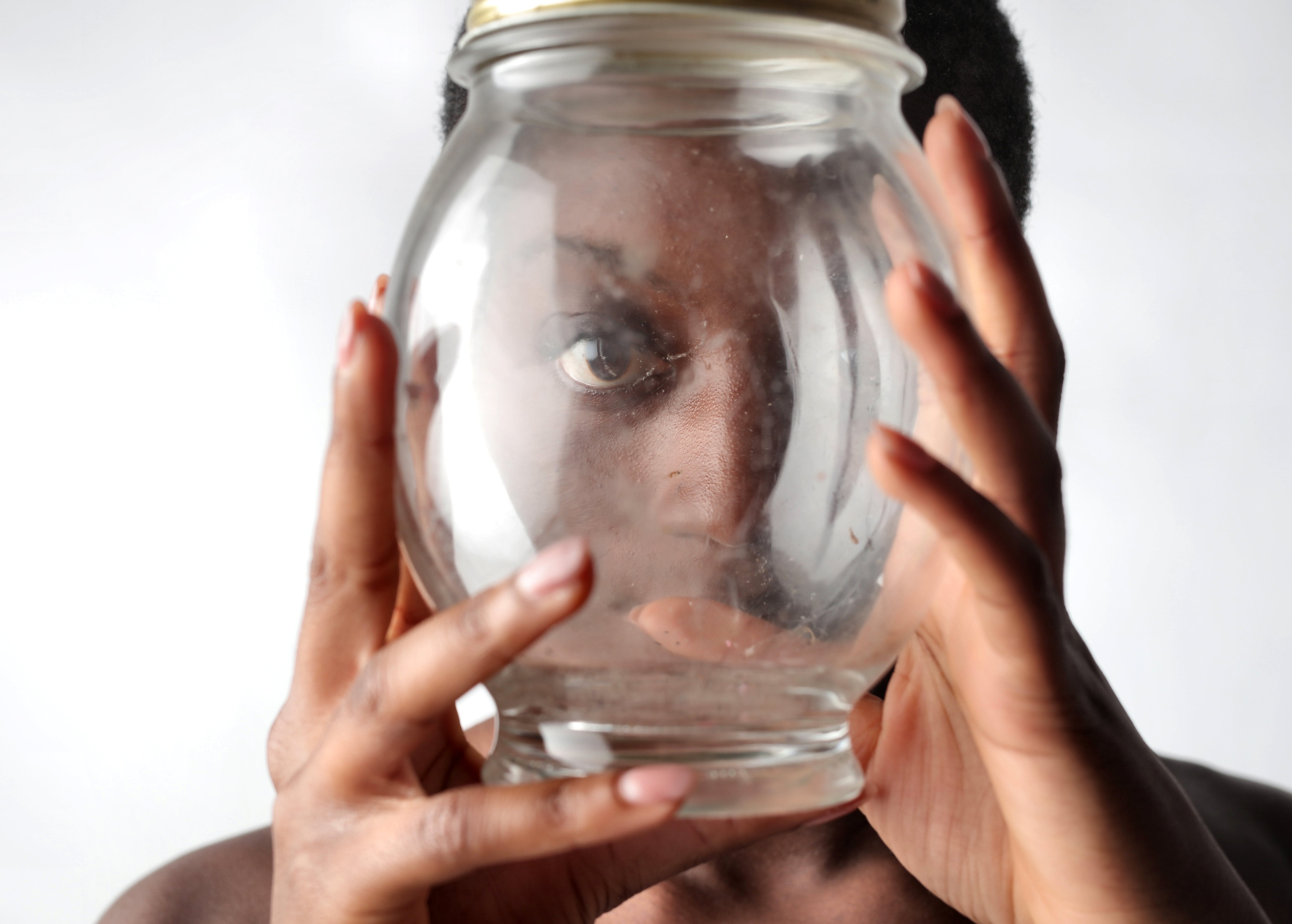 A person with EFDD and ADHD looks through a fishbowl